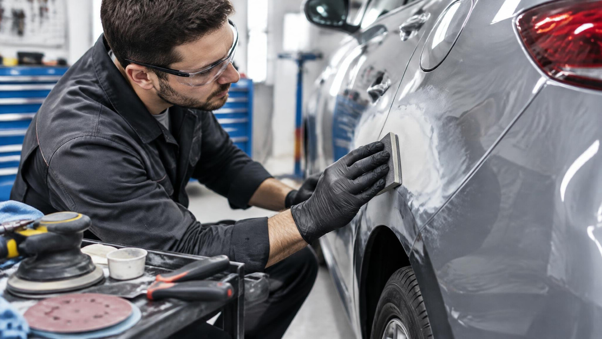 Mechanic working under the hood of a car